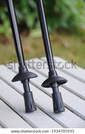 Nordic trekking hiking poles showing tip and ferrules close up. Royalty-Free Stock Photo #1934705933