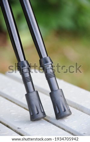Nordic trekking hiking poles showing tip and ferrules close up. Royalty-Free Stock Photo #1934705942