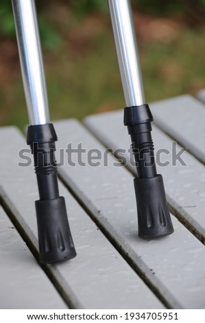 Nordic trekking hiking poles showing tip and ferrules close up. Royalty-Free Stock Photo #1934705951