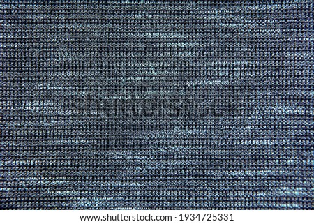 Woolen pattern with stripes in horizontal shades of gray in close-up