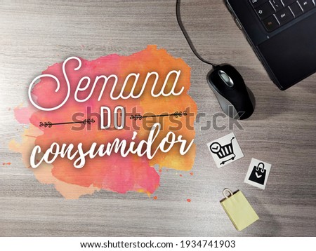 Semana do Consumidor. Consumer Week. Brazilian Portuguese Hand Lettering. notebook, mouse and shopping cart on wooden table. Shopping concept.
