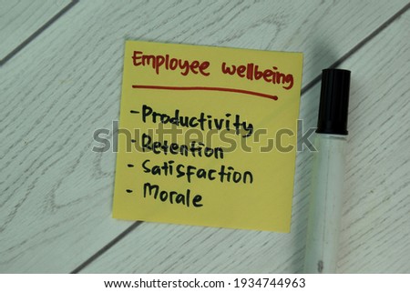 Employee Wellbeing write on sticky notes isolated on Wooden Table.