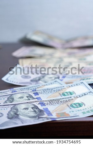 
Dollars in different denominations lie on the table