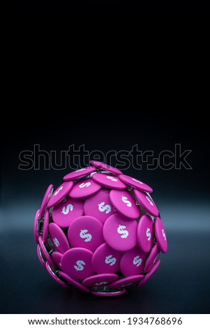 Dollar buttons on a ball, symbolic for the global economy with pink dollar buttons on black background with copy space. Vertical