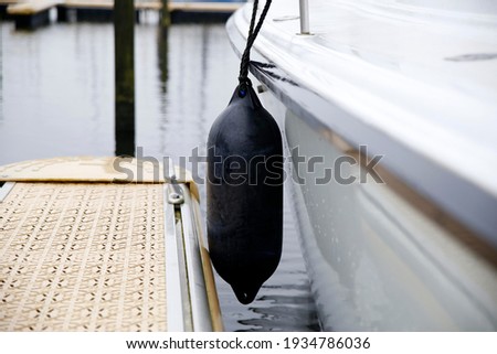 Close-up of the fenders of a sailing yacht