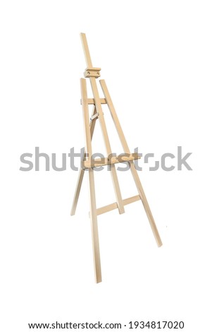 Isolated easel on a white background. Art canvas holder made of light wood. High quality photo