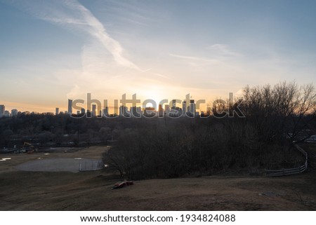 Toronto City Skyline at sunset from Riverdale Park in Ontario Canada