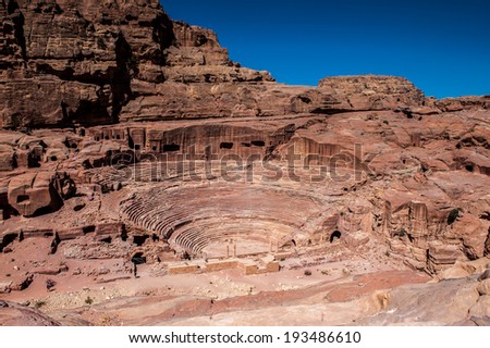 Ancient theater in Petra (Rose City), Jordan. The city of Petra was lost for over 1000 years. Now one of the Seven Wonders of the Word