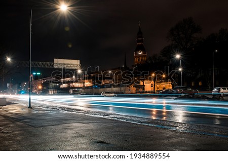 Long exposure photo at night. Light trails on the road