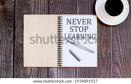 Word Writing Text never stop learning with pen and cofee. business concept on the wooden background