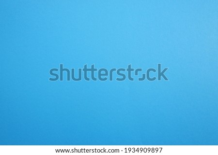 Paper, cardboard background. High resolution paper texture. Colored Blue background.