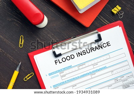 Conceptual photo about FLOOD INSURANCE Application Form with written phrase. 
