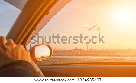 Driving a view of the plane picture in the evening and cars