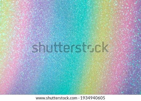 Iridescent rainbow background with glitter. Gradient stock texture with fine sparkles