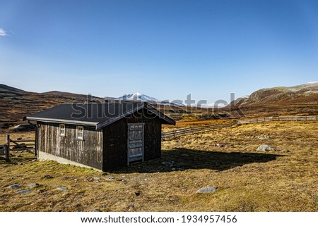 Hut in the Dovrefjell national park Royalty-Free Stock Photo #1934957456
