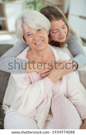 beautiful family of mother and daughter together hugging