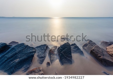 The sea and the rocks on the beach