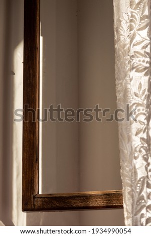 old window frame and old curtains in an old house in the evening