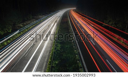 Truck light trails on highway. Art image . Long exposure photo taken on a highway.