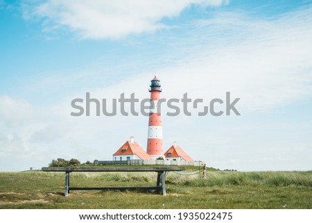 Westerheversand and lighthouse in Westerhever in North Frisia in the state Schleswig-Holstein Royalty-Free Stock Photo #1935022475