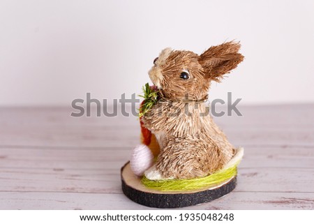 Easter toy bunny in cartoon style on white background. Holiday celebration.
