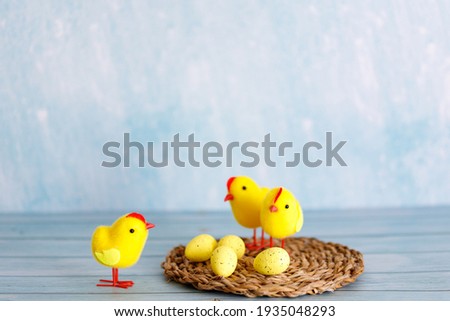 Beautiful blue easter background with chicks. Spring nature backdrop. Festive decorations. Cartoon easter background with chickens for decorative design.