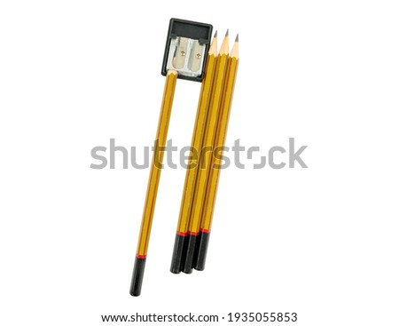 pencils and sharpener on white background close up
