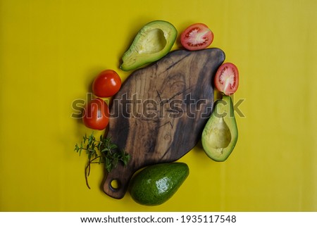 fresh fruit and wooden chalkboard,yellow background,top view