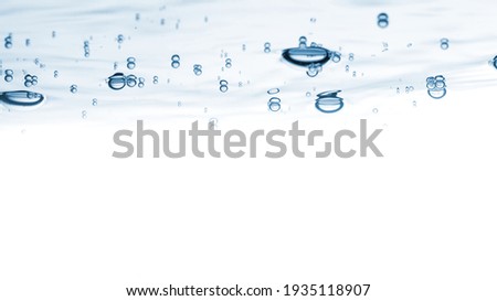 Water blue nature background. Bubbles on the clear water liquid surface