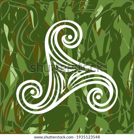 pagan celtic symbol triskele on green grass background