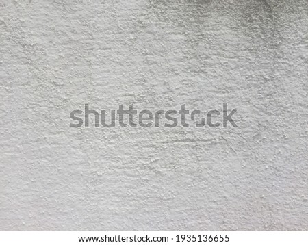 Old white concrete plastered floor.  White concrete wall for background, graphic design. Concrete floor white dirty old cement texture.