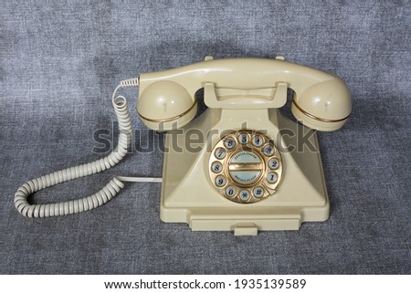 Oldschool telephone, telecommunication. Vintage objects. Royalty-Free Stock Photo #1935139589