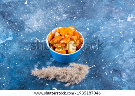 Reeds on the table, toasted bread in blue bowl. High quality photo