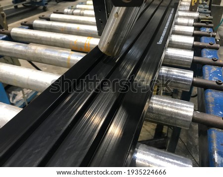 rubber profile on the production line Royalty-Free Stock Photo #1935224666