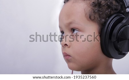 boy with headphones enjoying music on white background stock photo