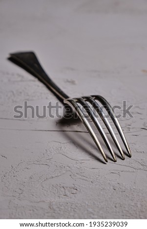 Fork on the background under the concrete. 