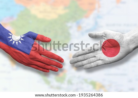 Taiwan and Japan - Flag handshake symbolizing partnership and cooperation Royalty-Free Stock Photo #1935264386