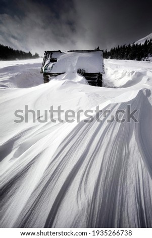 The tops of the mountain ranges of the Carpathians are covered with a terrible blizzard, many houses covered by snow. In the mountains there is an increased avalanche danger