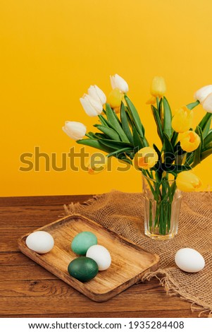 easter eggs bouquet flowers holiday yellow background