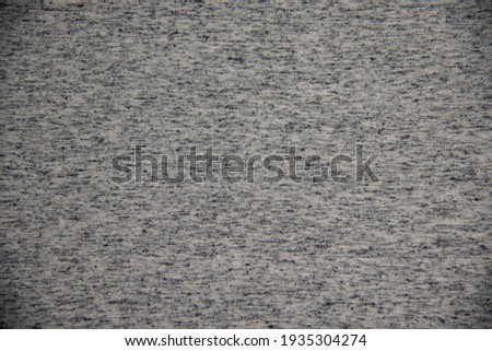 texture of woven or knitted fabric for abstract backgrounds in gray color
