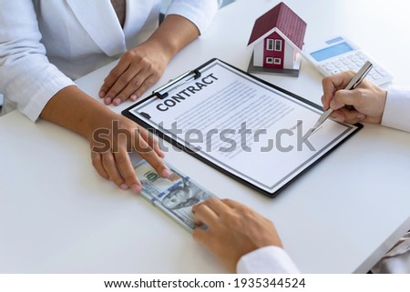 Real estate brokerage agent Offer for sale, pay deposit and sign contract agreement, home insurance concept. Making lease and buying a house