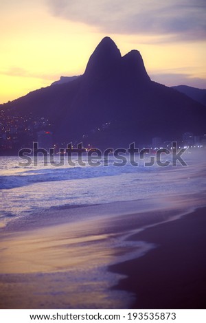 Sunset silhouette of Two Brothers Dois Irmaos Mountain Rio de Janeiro Ipanema Beach Brazil