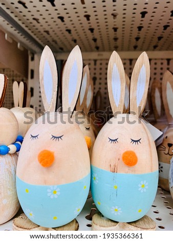 Easter decoration eggs like rabbits in the shop shelf. Easter bunnies. Vintage style picture