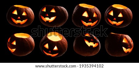 A set of glowing pumpkins. Isolated on a black background