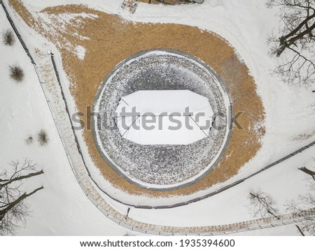 Snow-covered arbor in the Kiev park. Aerial drone view. Winter snowy morning.