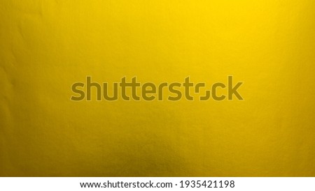 Gradation gold foil leaf shiny with sparkle yellow metallic texture background.
Abstract paper glitter golden glossy for template.
top view.