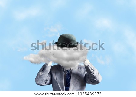 Businessman in a hat, with a cloud instead of a head, with arms raised. The concept of tough decision making, creative thinking, creativity, business. Business. Royalty-Free Stock Photo #1935436573