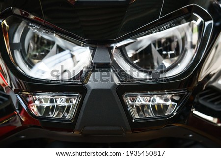 Headlight of the tourist motorcycle. Royalty-Free Stock Photo #1935450817