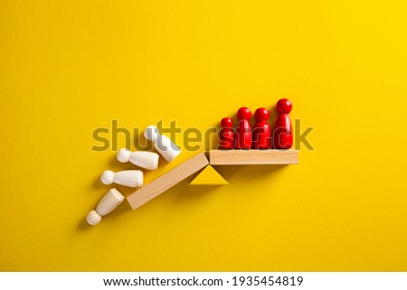 Team standing on a wooden seesaw, one side winner and one side loser. Success and failure. Business and workplace competition. Royalty-Free Stock Photo #1935454819