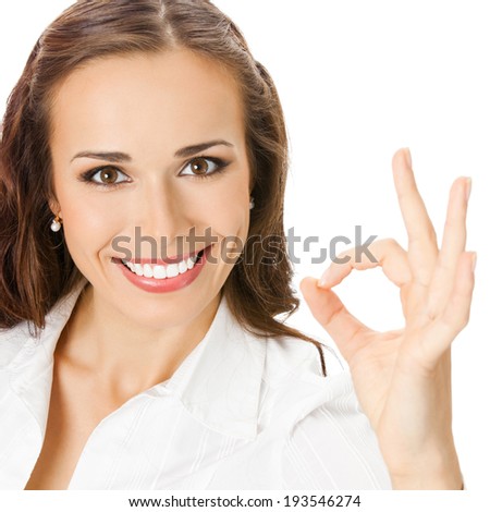 Happy smiling beautiful young business woman showing okay gesture, isolated over white background